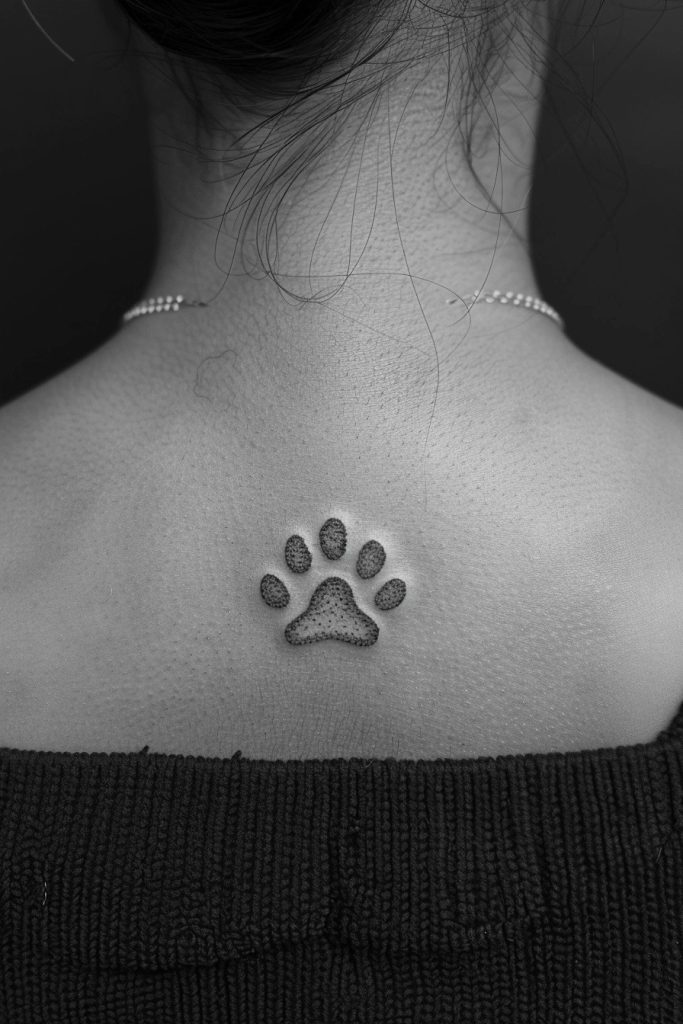 Minimalist Paw Outline Tattoo